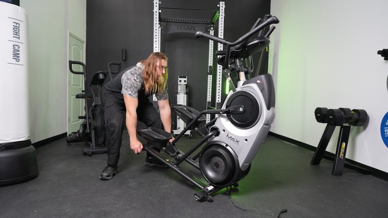 Our tester moving the Bowflex Max Trainer M6 into position for a workout.