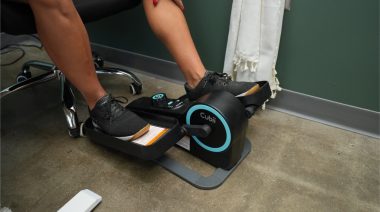 a person using the Cubii Move Under-Desk Elliptical