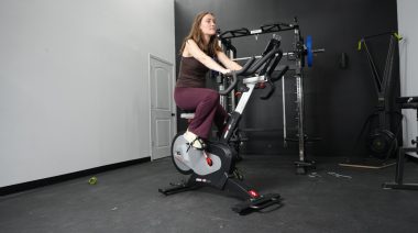 a person riding an exercise bike