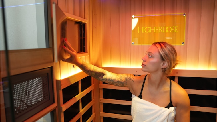 Tester makes adjustments in the HigherDOSE infrared sauna.