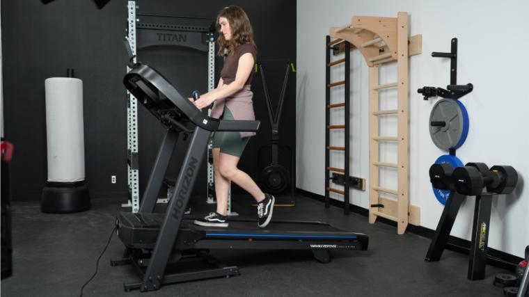 a person walking on the Horizon 7.0 AT Treadmill