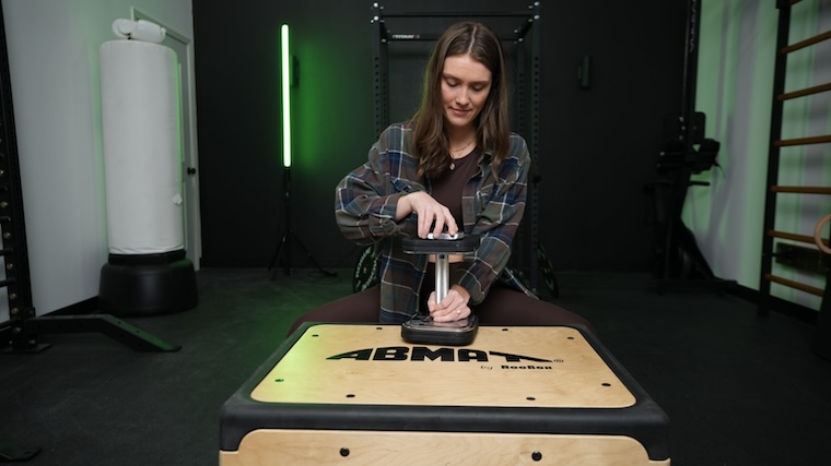 Our tester adjusting the weight on the IronMaster Quick-Lock Adjustable Dumbbell