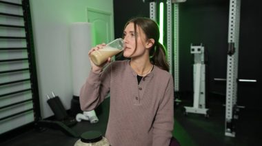 Our tester drinks a shake made with Naked Pea Protein Powder