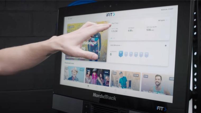 A person selecting an iFIT class on the NordicTrack S22i.