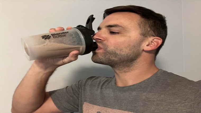 Our tester having a shake of NOW Sports Whey Protein Isolate