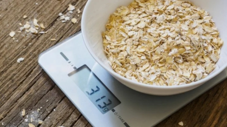 Oatmeal being weighed on food scale