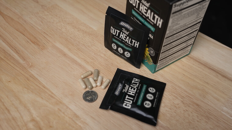 Onnit Total Gut Health size comparison with coin