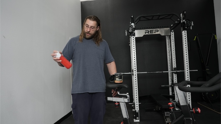 Our tester mixing a shaker of Optimum Nutrition Gold Standard Pre-Workout