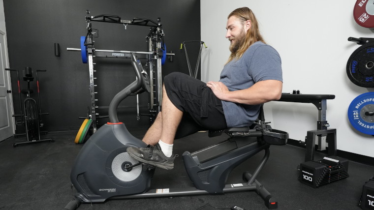 A BarBend Tester on the Schwinn 230 Recumbent Bike.