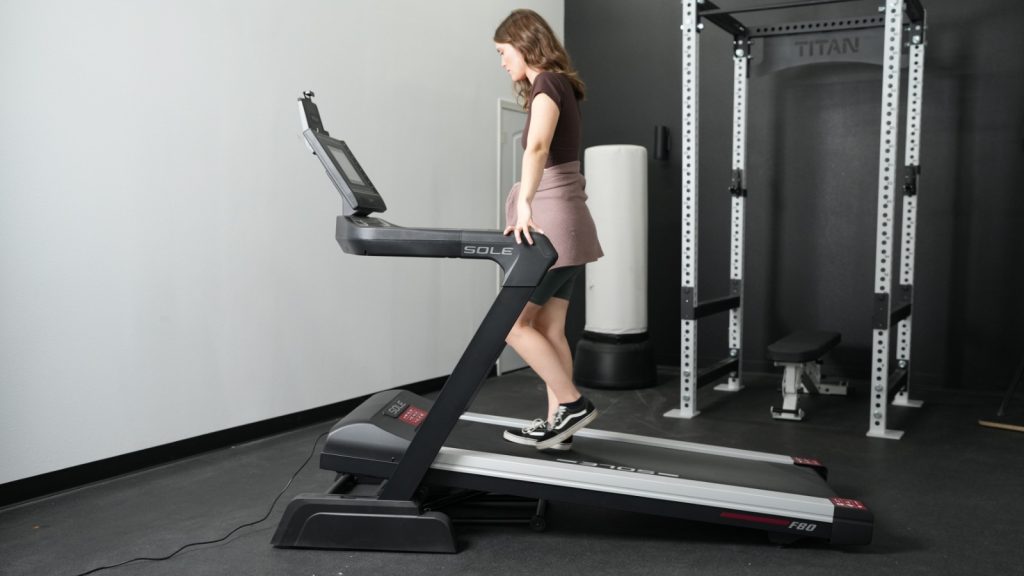 Our tester walking on a Sole treadmill.