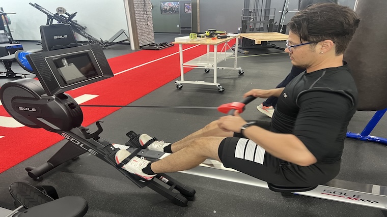 Our tester training atop the Sole SR550 rowing machine