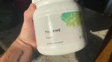 Our tester holds a tub of Thorne Creatine.