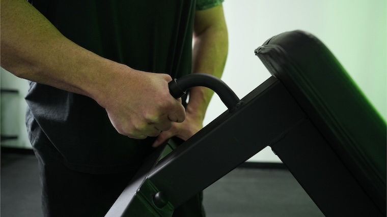 The transport handle featured at the base of the Titan Fitness Elite Series Single Post Flat Bench