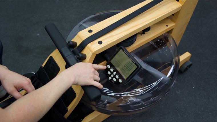 Our tester adjusting the settings on the WaterRower.