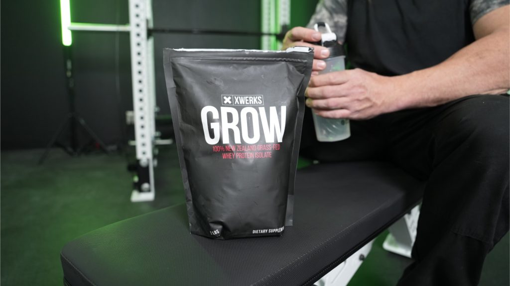 a bag of Xwerks Grow Protein in the BarBend gym