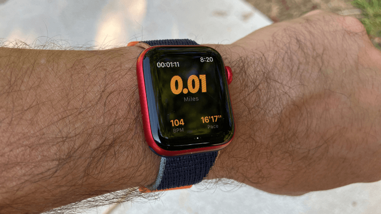 A person using the Nike Run Club app on an Apple Watch.