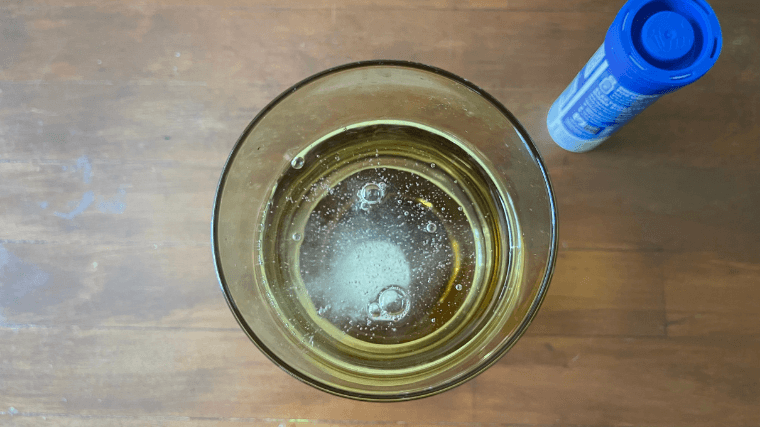 A Nuun tablet dissolving in a glass of water