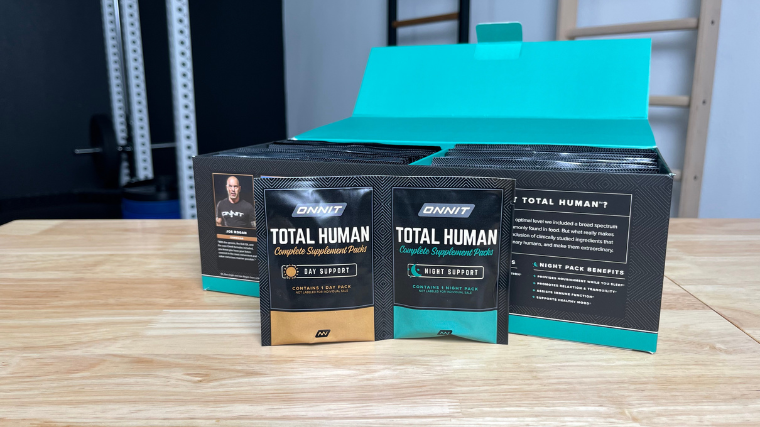 Packets of Onnit Total Human multivitamins sit outside the box.